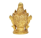 Brass Tara Devi statue back view, flowing hair motif and tall crown