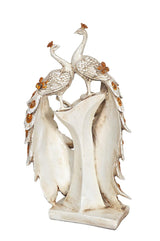 Resin peacock couple figurine, birds perched on carved pedestal base with gold accents