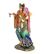 Radha-Krishna idol statue from side, Krishna holding flute while Radha leans close