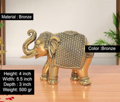 Bronze elephant figurine with detailed saddle pattern and decorative head ornament, 4 inch