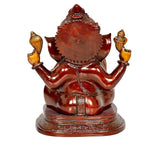 Rear view of Ganesha idol statue, red-brown sheen and raised arms