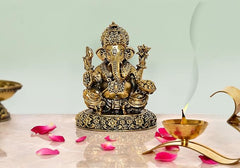 Brass Ganesha statue, 5 inch, seated with four arms and ornate base