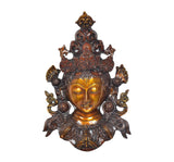 Ornate Tara mask front view, gold-toned face with closed eyes and carved crown