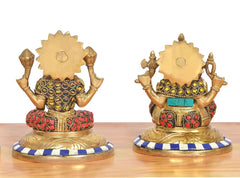Brass Lakshmi and Ganesha statues, rear view with round halo designs and beadwork.