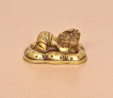 Brass Baby Ganesh statue, golden tone, opposite angle with ornate base details