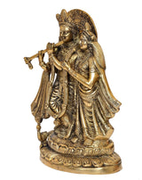 Brass Radha Krishna idol statue, side view showing Radha’s veil and Krishna’s flute