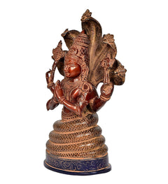 Brass Patanjali figurine from side angle, seated with ornate cobra hood and earrings