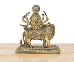 Brass Durga Maa statue on lion, back/side view with draped garments and jewelry