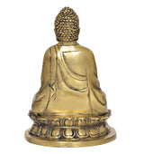 Rear view of gold brass meditating Buddha statue, ornate robe details