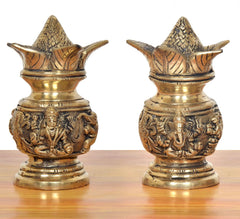 Two brass kalash showpieces with carved Lakshmi & Ganesh motifs, gold finish