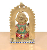 Brass Ganpati Bappa murti back view with arched halo and multicolor outfit