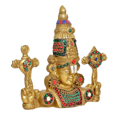 Brass Tirupati idol side view, gold arms raised with jeweled multicolour accents