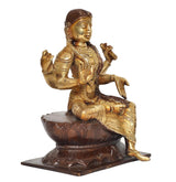 Gold-tone brass goddess statue, seated on lotus base, one hand raised