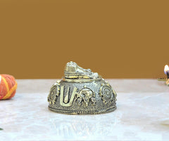 Brass charan paduka idol, angled view of two feet on top