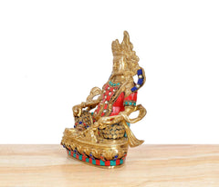 Brass Kuber murti idol, side view seated deity with red tunic and blue ornaments