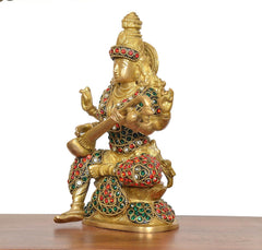 Brass Saraswati statue in profile, jeweled outfit, holding veena