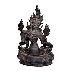 Close angle Tara Devi statue, multi-armed goddess with elaborate headdress, dark resin