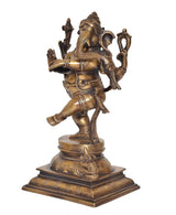 Brass dancing Ganesha figurine on square pedestal base, side view