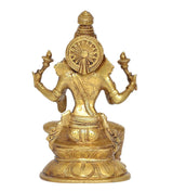 Brass Lakshmi statue, back view with round halo disk above lotus base