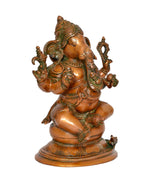 Brass Ganesha statue back/left angle, seated figure with carved jewelry and arms