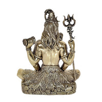 Rear view brass Lord Shiva idol with long hair, trident beside seated base
