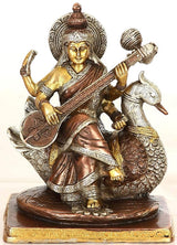 Brass Saraswati seated on swan statue, playing veena, 7.5 inch