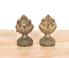 Brass diya shankh oil lamp stands set with detailed Vishnu-style symbol faces on top