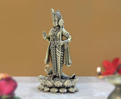 Brass Lord Kartikeya Murugan Murti side view, raised staff in hand, lotus pedestal