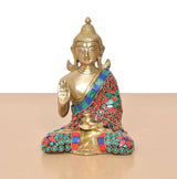 Front view Brass Buddha idol seated, gold tone, multicolor jeweled robe