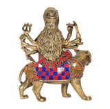 Back view of Durga Maa idol on lion, gold tone and blue red patterned ornaments