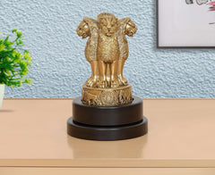 Brass Ashoka figurine with revolving dark base, standing figure with ornate details