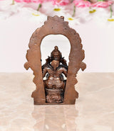 Copper Ganesha statue back view inside a large ornamental arch
