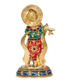 Brass Krishna idol statue, back view with green top and red skirt, jeweled base