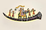 Iron wall decor: curved dark platform with standing figures and ornate details