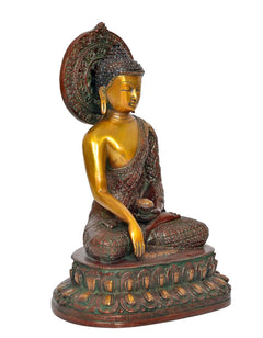 Seated Buddha statue side angle, brass face and hands, detailed patterned sash