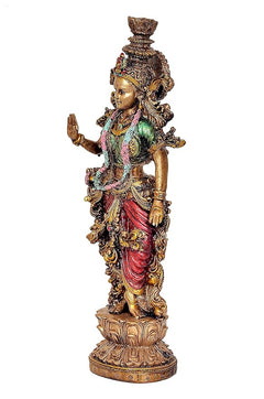 Radha Rani resin idol, side view with raised hand and red-gold flowing garments