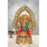 Brass Lakshmi maa statue with jeweled halo, red and teal accents, standing pose