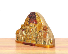 Brass Gaja Lakshmi idol angled view, elephants flanking the seated goddess