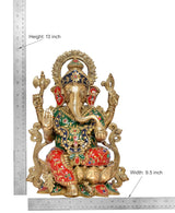 Brass Ganesha idol with measurements: 13 in height, 9.5 in width, colorful seated clothing