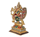 Saraswati brass figurine on decorated pedestal, swan beneath, colorful enamel accents