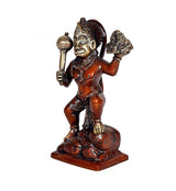 Hanuman ji statue in side view, holding mace and lifting rock, seated on pedestal