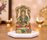 Brass Gaja Lakshmi idol with elephant motif, seated and adorned in colorful jeweled patterns.