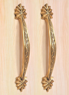Set of two golden brass handles featuring leaf-carved stems and starburst rosette end caps.