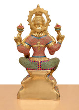 Back view of Lakshmi brass idol, carved backplate and multicolor dress details