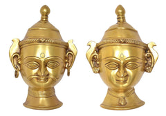 Brass Shiva Gauri head wall hanging, angled front view with crown finial