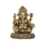 Brass Ganesha statue front view, detailed crown, four arms and ornate pedestal