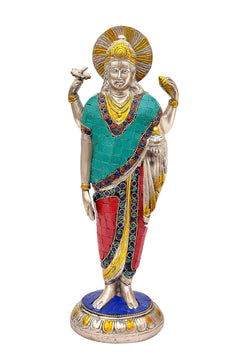 Standing brass Dhanvantari figure with halo, teal top, red lower garment, jeweled details