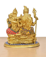 Brass Shiv Parivar idol, back view with flowing hair and raised staff on blue base