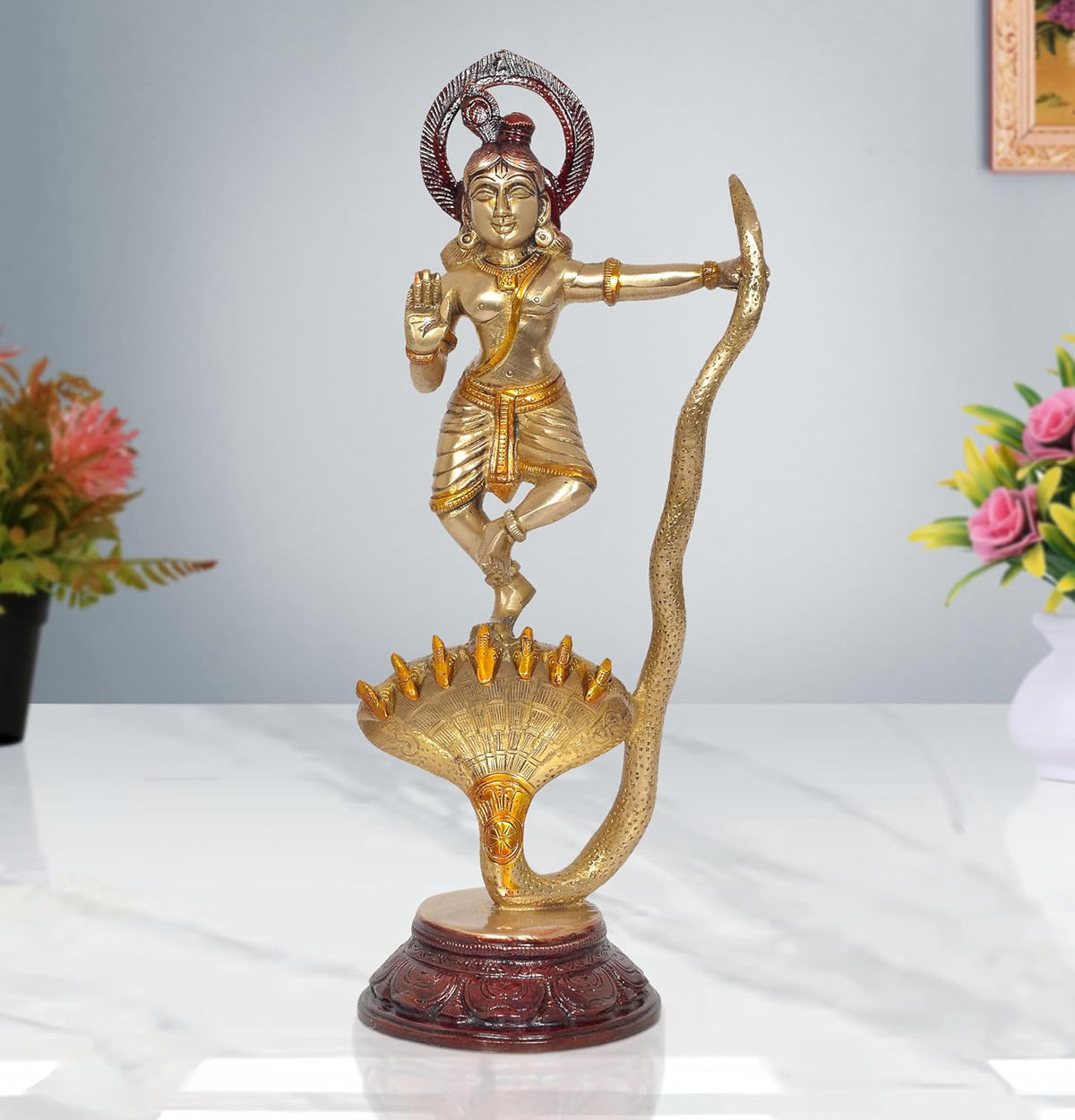 Brass Krishna statue dancing on Kaliya serpent, halo and maroon pedestal base