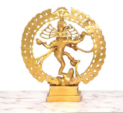 Close-up brass Shiva Nataraj dancer in golden ring halo with raised arms
